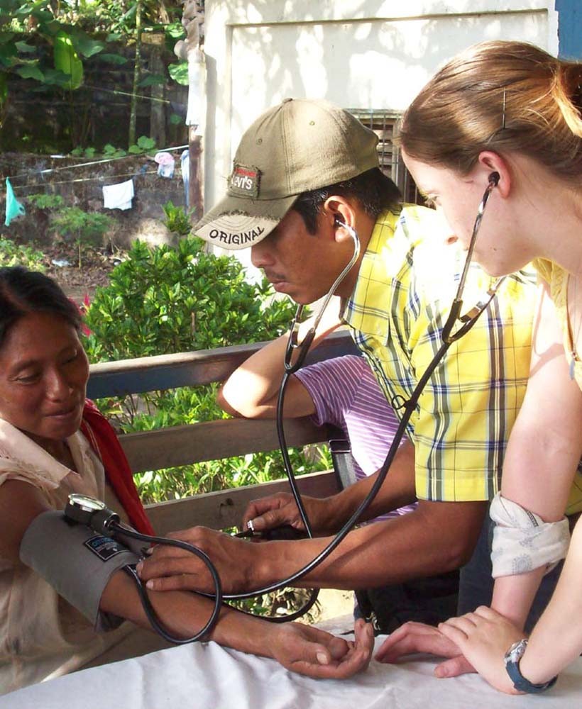 Student listens to blood pressure sounds in Nicaragua.